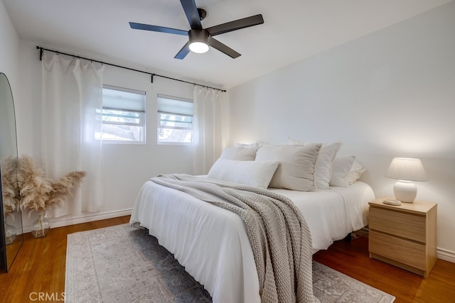 bedroom featuring dark hardwood / wood-style floors and ceiling fan