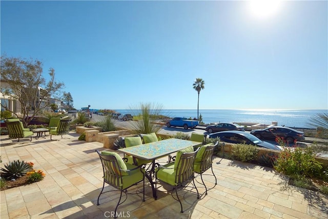 view of patio featuring a water view