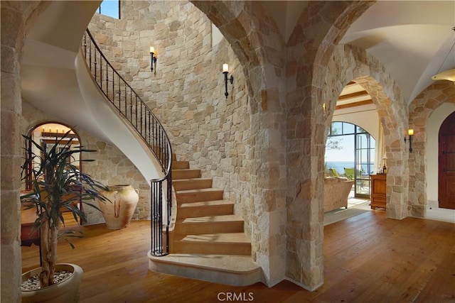 stairway featuring wood-type flooring