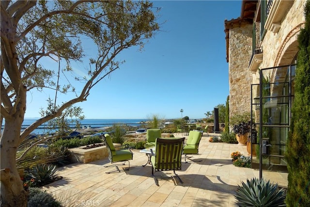 view of patio / terrace featuring a water view