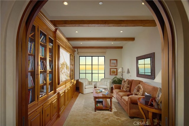 sitting room with beam ceiling