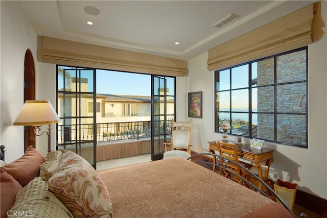 bedroom with multiple windows