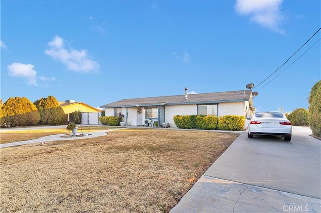 ranch-style home with a front yard