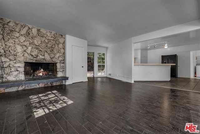 unfurnished living room featuring a fireplace