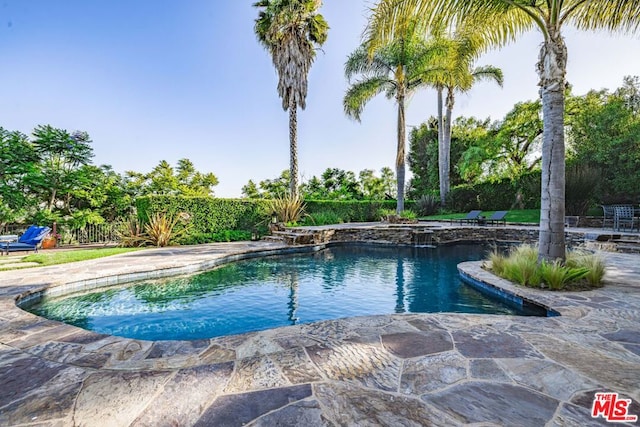 view of pool featuring a patio area