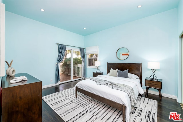 bedroom featuring dark wood-type flooring and access to exterior