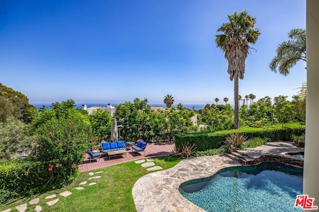 view of swimming pool with a wooden deck and an outdoor hangout area