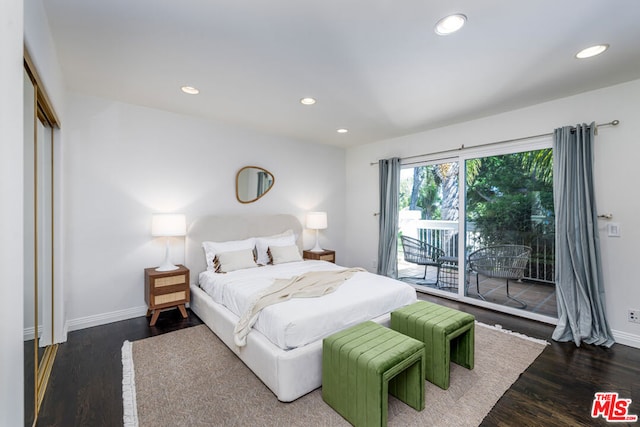 bedroom featuring access to exterior and dark hardwood / wood-style flooring