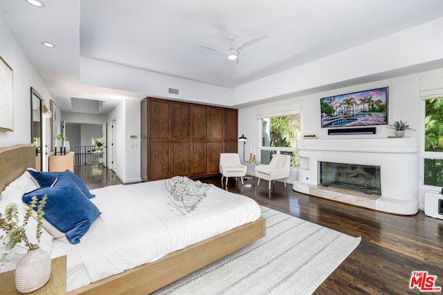 bedroom featuring dark wood-type flooring and ceiling fan