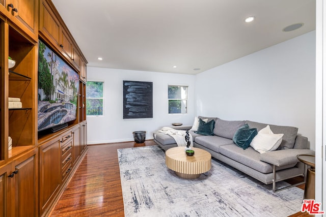 living room with dark hardwood / wood-style floors