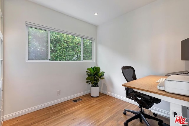 home office with light wood-type flooring