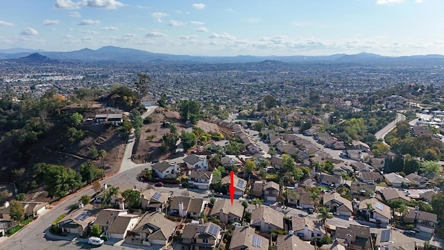 birds eye view of property featuring a mountain view