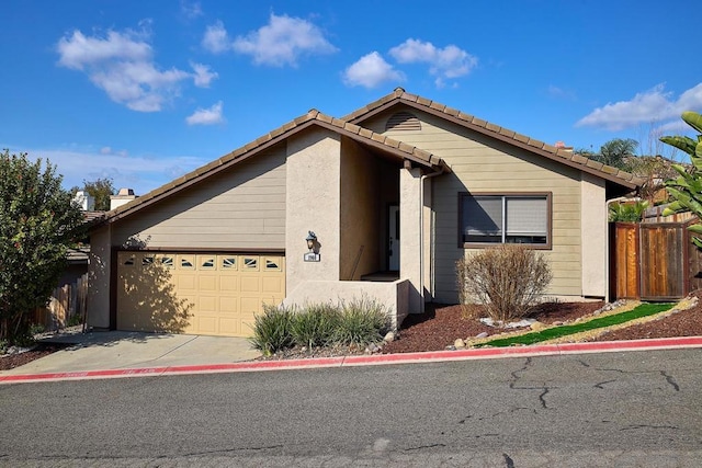 single story home featuring a garage