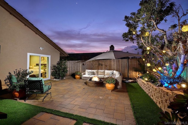 patio terrace at dusk with an outdoor hangout area