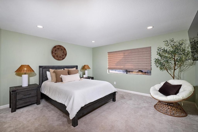 bedroom featuring light colored carpet