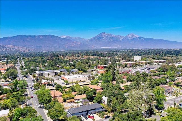 birds eye view of property with a mountain view