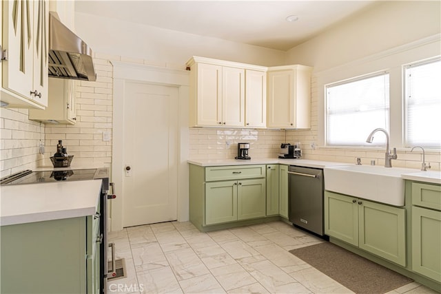 kitchen featuring sink, green cabinets, appliances with stainless steel finishes, white cabinets, and exhaust hood