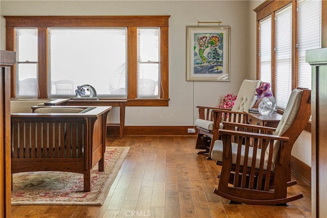 living area with hardwood / wood-style floors