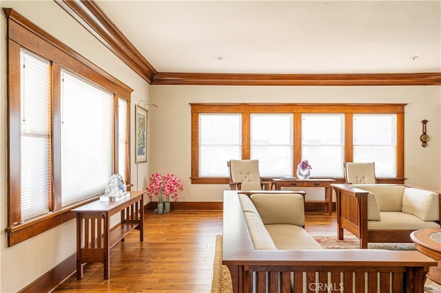 living room featuring hardwood / wood-style floors and crown molding