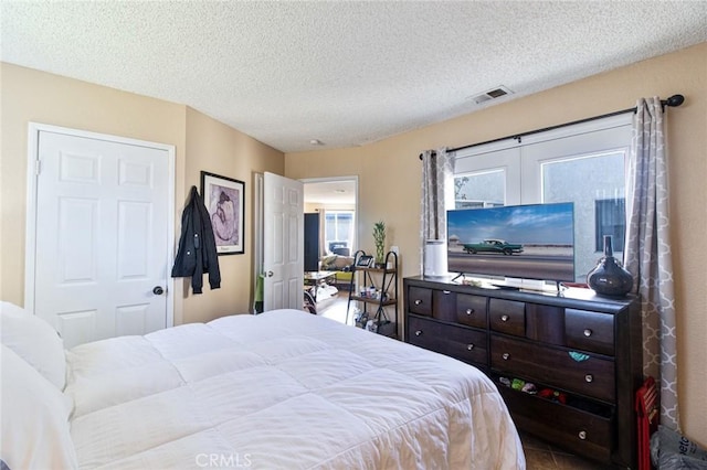 bedroom featuring a textured ceiling