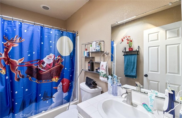 full bathroom featuring vanity, toilet, and shower / bath combo with shower curtain