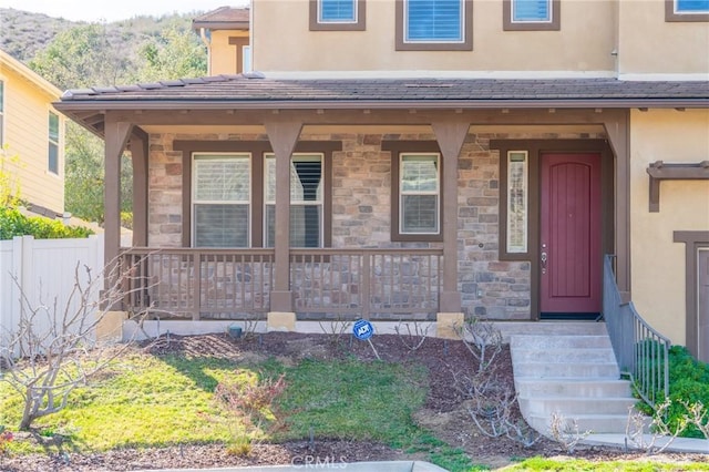 doorway to property with covered porch