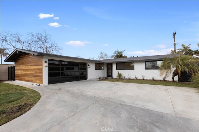 ranch-style home featuring a garage