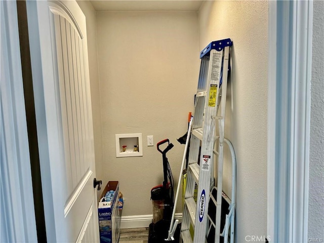 laundry area featuring hookup for a washing machine and wood-type flooring