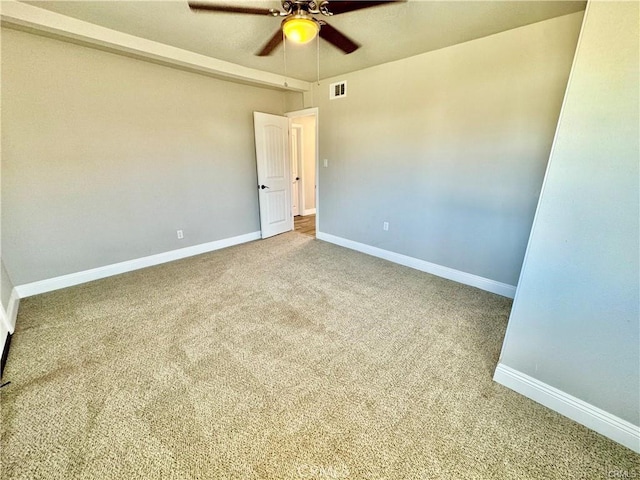 carpeted empty room featuring ceiling fan