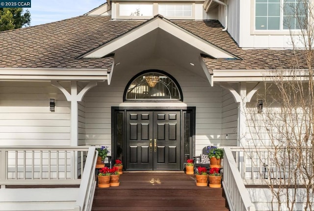 doorway to property featuring covered porch