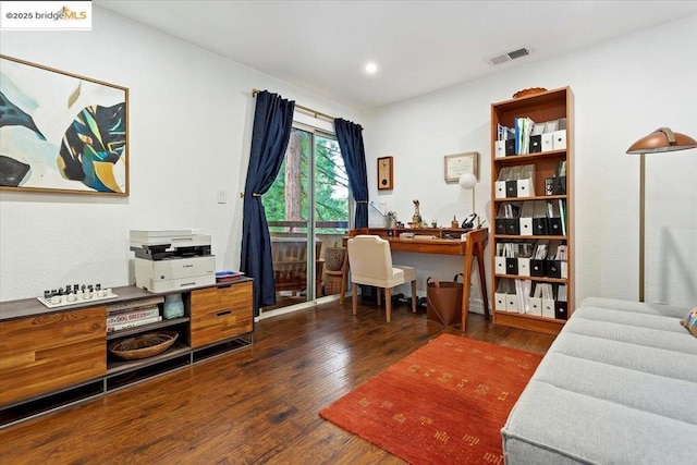 office with dark hardwood / wood-style floors