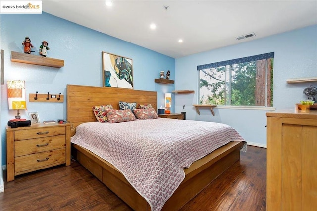 bedroom featuring dark hardwood / wood-style flooring