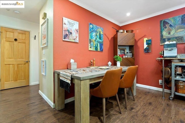 dining area featuring crown molding and dark hardwood / wood-style floors