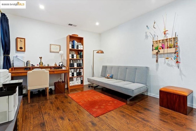 living area with dark hardwood / wood-style flooring