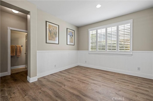 spare room featuring hardwood / wood-style floors