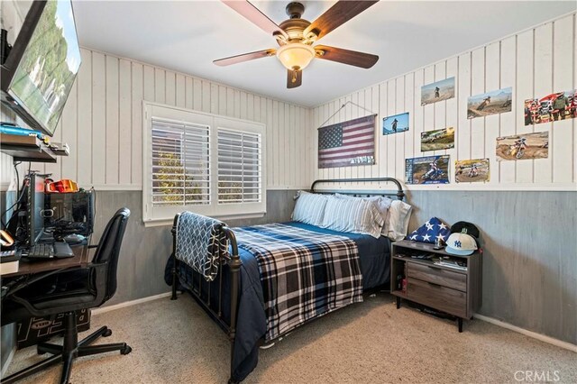 bedroom featuring light colored carpet and ceiling fan