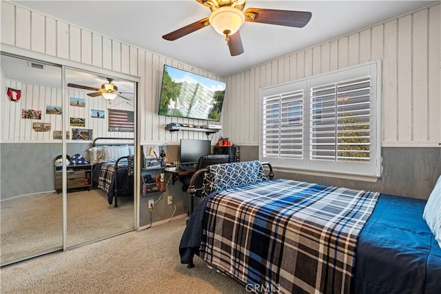 bedroom featuring a closet, ceiling fan, and carpet