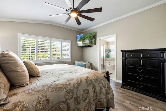 bedroom with lofted ceiling, hardwood / wood-style flooring, ceiling fan, crown molding, and ensuite bath