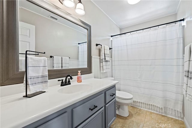 bathroom with walk in shower, tile patterned floors, vanity, and toilet