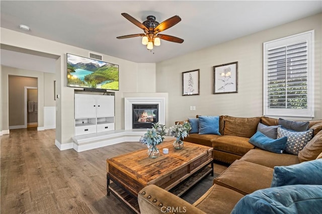 living room featuring hardwood / wood-style flooring and ceiling fan