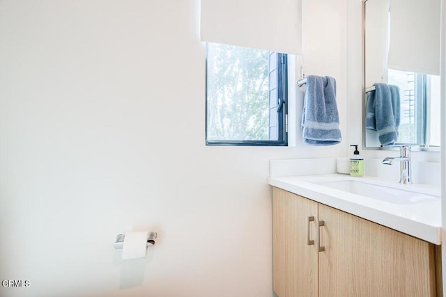 bathroom featuring vanity and plenty of natural light