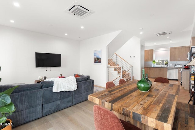 living room with light hardwood / wood-style floors