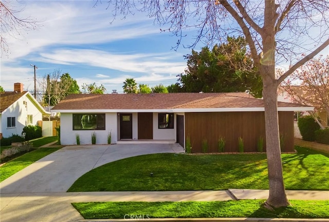 ranch-style house with a front lawn