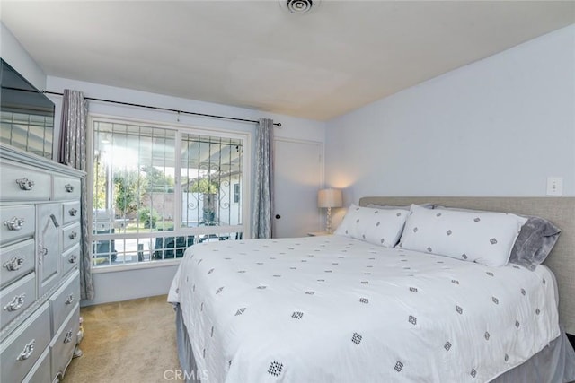 bedroom with light colored carpet