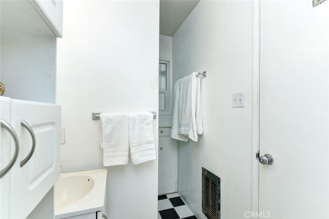 bathroom featuring vanity and heating unit