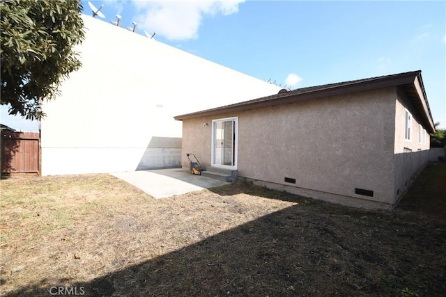 back of property featuring a patio area