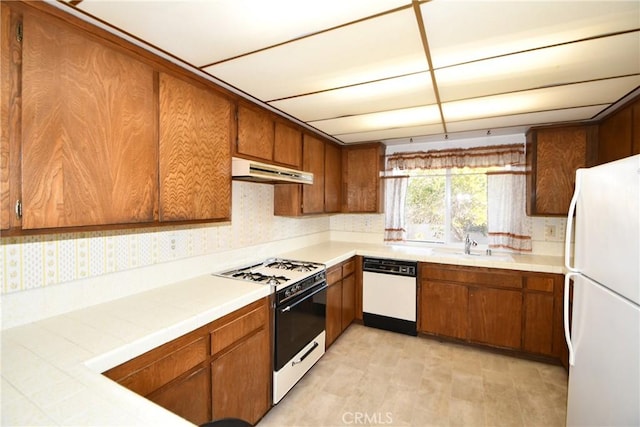 kitchen with sink and white appliances