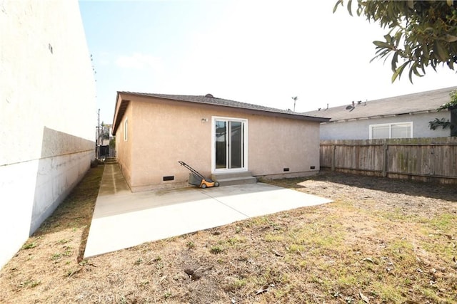 rear view of house with a patio