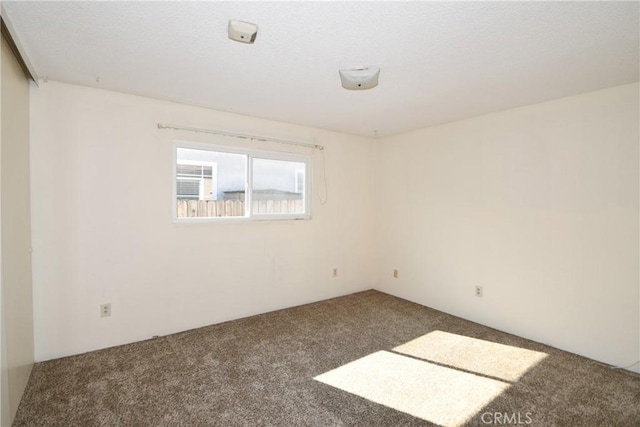 spare room with carpet flooring