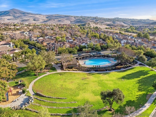 birds eye view of property featuring a mountain view